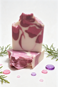 white, Purple &  Pink Swirl design  with a chunky textured top surrounded with candy water droplets and sprigs of fern.