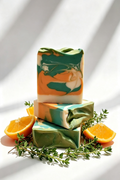 2.	Sweet Orange & Tea Tree natural soap bar by The Clean Theory Soap Co, chunky square soap with vibrate green and orange swirl pattern